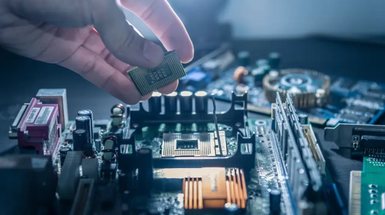 The,Technician,Is,Putting,The,Cpu,On,The,Socket,Of