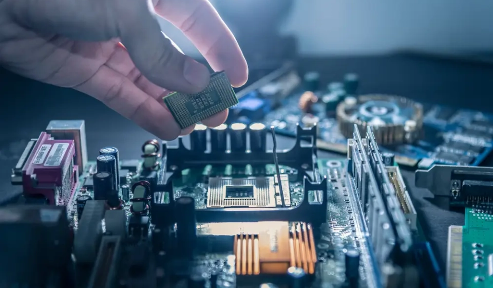 The,Technician,Is,Putting,The,Cpu,On,The,Socket,Of